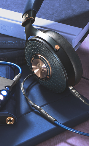 HiFi headphones with cable and DAP on stack of books - Moon Audio