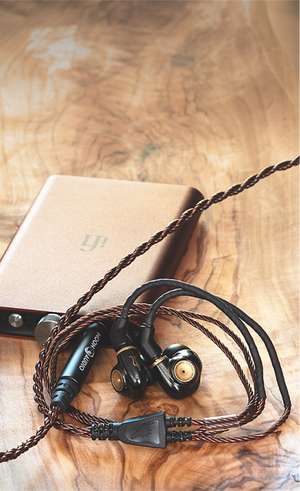 DAP on desk with earbuds cables attached - Moon Audio