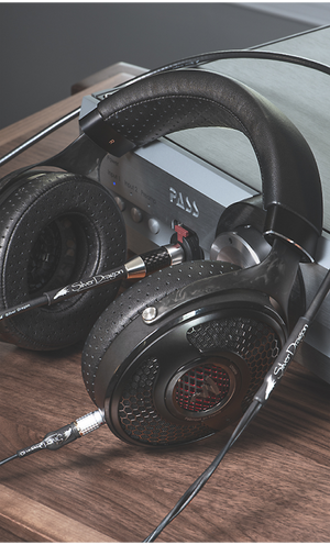 High end Focal headphones with Silver Dragon Cable leaning on streaming player - Moon Audio