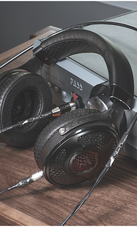 High end Focal headphones with Silver Dragon Cable leaning on streaming player - Moon Audio